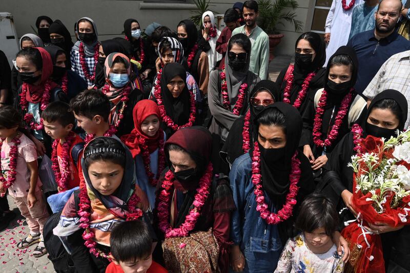 Young Afghan footballers were given floral garlands after arriving in Lahore, Pakistan, a month after the Taliban took power in Afghanistan. AFP