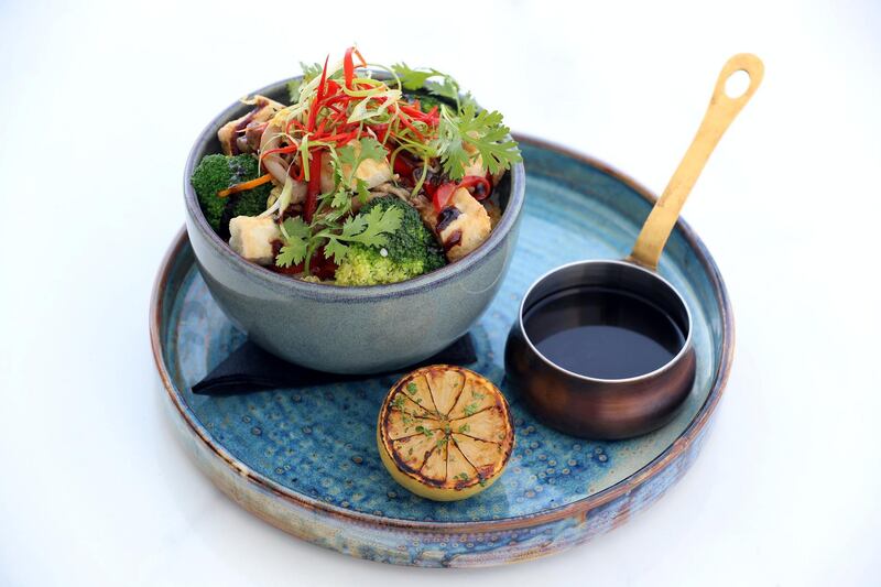 Dubai, United Arab Emirates - May 16, 2019: Iftar Signature Dish. Vegan Tofu & Mushroom Donburi:ÊAsian mushroom, stir-fried vegetables, vegetarian teriyaki sauce and toasted sesame seeds from Hillhouse Brasserie. Thursday the 16th of May 2019. Dubai Hills Golf Club, Dubai. Chris Whiteoak / The National

Chefs description: A rather simple dish made exciting with a great mix of savoury vegetables over a bed of rice. An extremely healthy and flavourful dish, our Vegan Tofu & Mushroom Donburi is gluten-free and is a level-up from the usual vegan dishes. The combination of the flavours from the vegetable broth and sauce makes for a delicious meal.