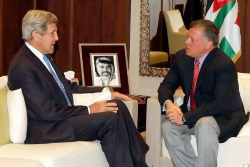 Jordan King Abdullah II (right) meets with US secretary of state John Kerry in Amman yesterday.