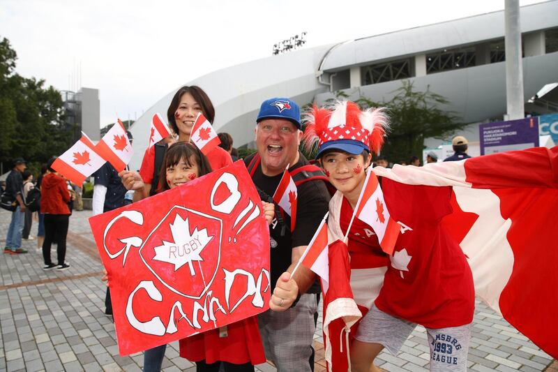 Fans of Canada pose for a photo as they arrive at the Fukuoka Hakatanomori Stadium. Getty