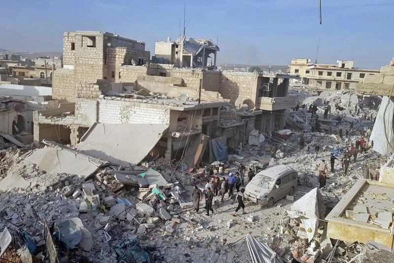 This photo released Nov. 14, 2017 by the Syrian anti-government activist group Local Council of Atareb City, which has been authenticated based on its contents and other AP reporting, shows a destroyed market that was struck by Russian warplanes in the town of Atareb in Idlib province, Syria. The U.N.â€™s Commission of Inquiry on Syria said Tuesday, March 6, 2018, that a Russian plane was apparently behind the deadly airstrike in November in Syriaâ€™s Idlib province that killed 84 people at a marketplace, an attack which could amount to a war crime. (Local Council of Atareb City via AP)