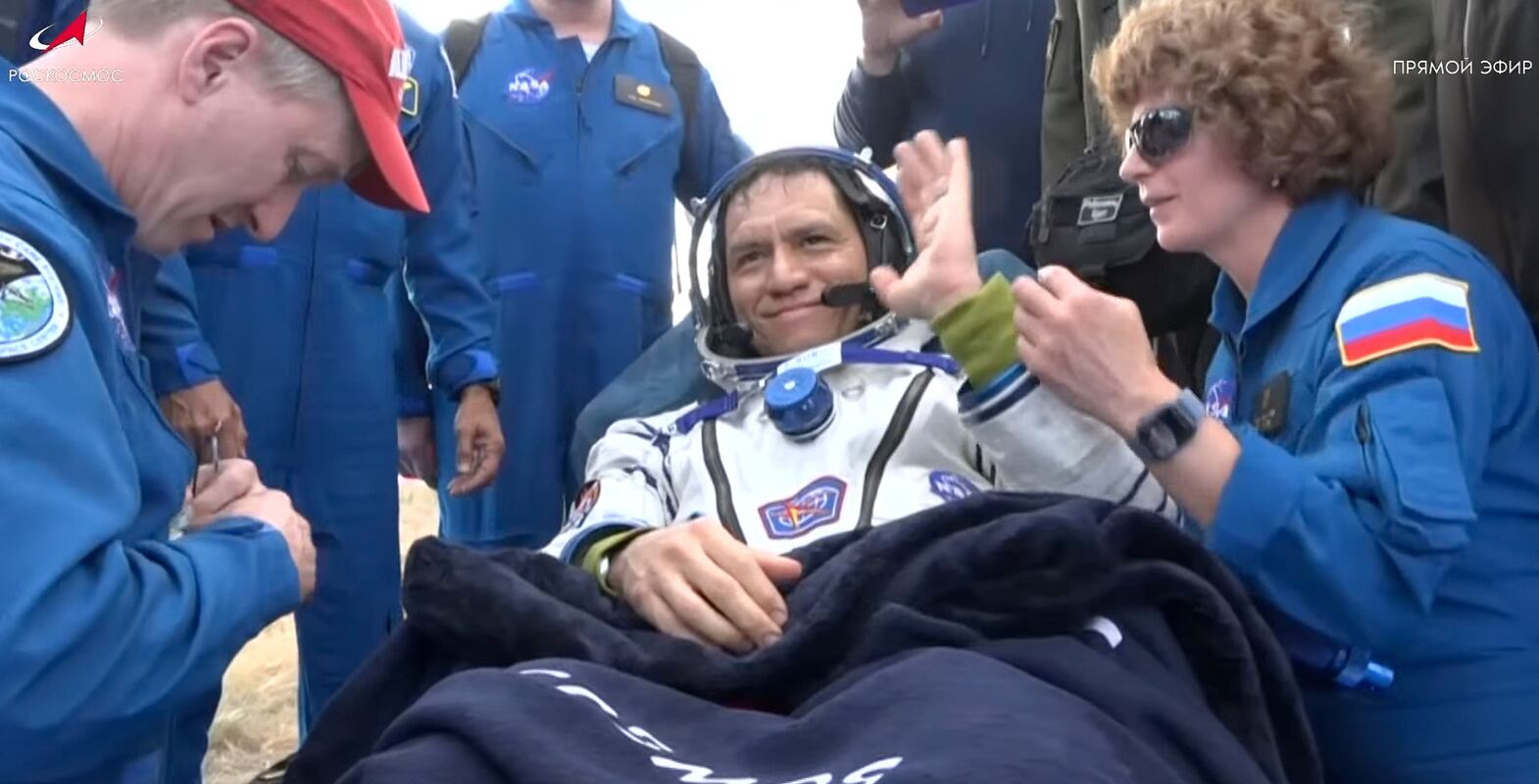 In this photo taken from video released by Roscosmos space corporation, NASA astronaut Frank Rubio sits in chairs shortly after the landing of the Russian Soyuz MS-23 space capsule about 150 km (90 miles) south-east of the Kazakh town of Zhezkazgan, Kazakhstan, Wednesday, Sept.  27, 2023.  The Soyuz capsule carrying NASA astronaut Frank Rubio, Roscosmos cosmonauts Sergey Prokopyev, and Dmitri Petelin, touched down on Wednesday on the steppes of Kazakhstan.  (Roscosmos space corporation via AP)