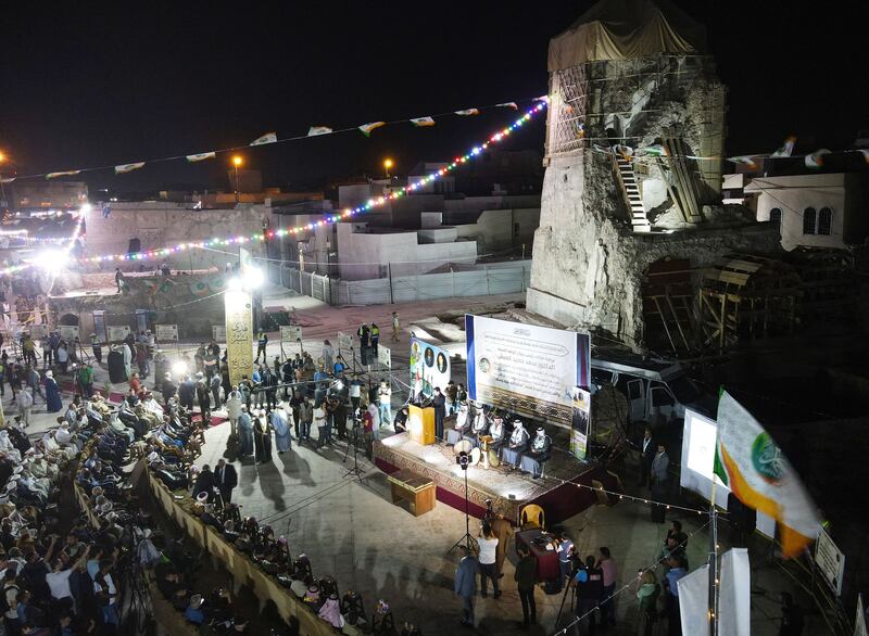 Lights and decorations adorn the remains of the war-ravaged Al Nuri Mosque, as Iraqis gather to celebrate the birth of the Prophet Mohammed.