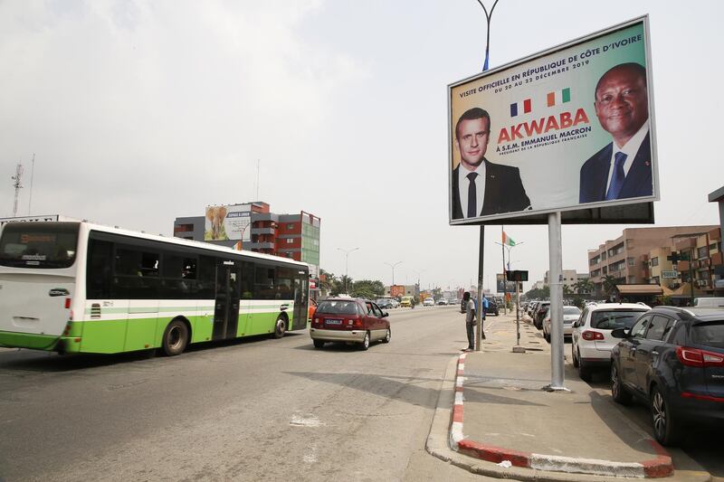 A billboard announcing the visit of French President Emmanuel Macron in Abidjan, Ivory Coast.  EPA