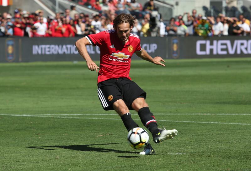 Manchester United defender Daley Blind scores a goal during the penalty kick shootout against Real Madrid in the International Champions Cup match on July 23, 2017 in Santa Clara, California.   / AFP PHOTO / Beck Diefenbach
