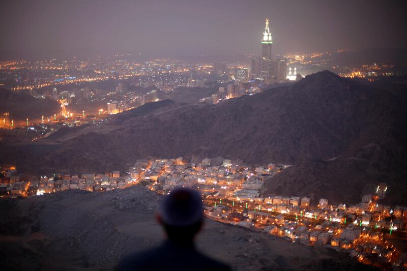 FILE PHOTO: A Muslim pilgrim prays atop Mount Thor in the holy city of Mecca ahead of the annual haj pilgrimage October 11, 2013. REUTERS/Ibraheem Abu Mustafa/File Photo