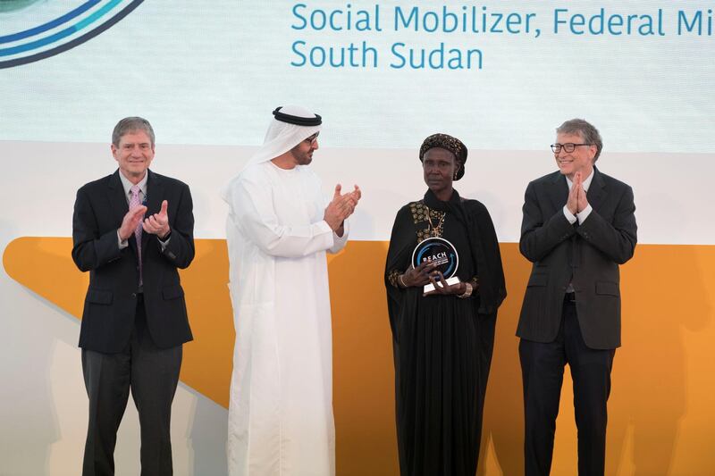 AL MARYAH ISLAND, ABU DHABI, UNITED ARAB EMIRATES - November 15, 2017: HH Sheikh Mohamed bin Zayed Al Nahyan, Crown Prince of Abu Dhabi and Deputy Supreme Commander of the UAE Armed Forces (3rd R), presents a REACH award to Regina Lotobay Lomar (2nd R), during the Global Health Forum. Seen with Bill Gates, Co-chair and Trustee of Bill & Melinda Gates Foundation (R) and Gabriel Carter (L).

( Hamad Al Kaabi / Crown Prince Court - Abu Dhabi )
---