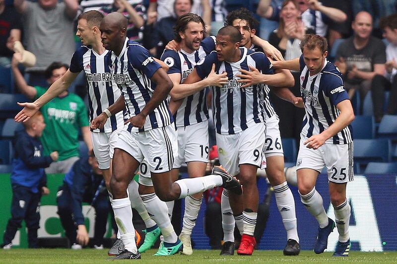 West Bromwich Albion's Salomon Rondon, centre right, celebrates scoring his side's second goal of the game with teammates during the English Premier League soccer match between West Bromwich Albion and Liverpool, at The Hawthorns, West Bromwich, England, Saturday April 21, 2018. (Nigel French/PA via AP)