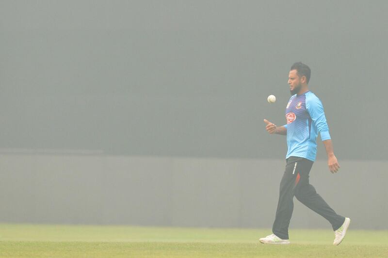 Bangladesh's Arafat Sunny during training as thick smog envelopes the Arun Jaitley Cricket Stadium in New Delhi on Friday. AFP