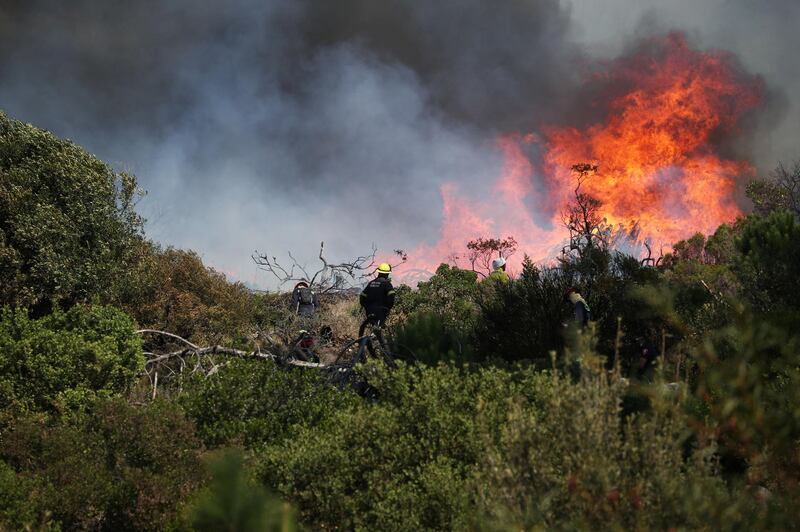 Fire crews battle to contain the bushfire that broke out on the slopes of Table Mountain. Reuters