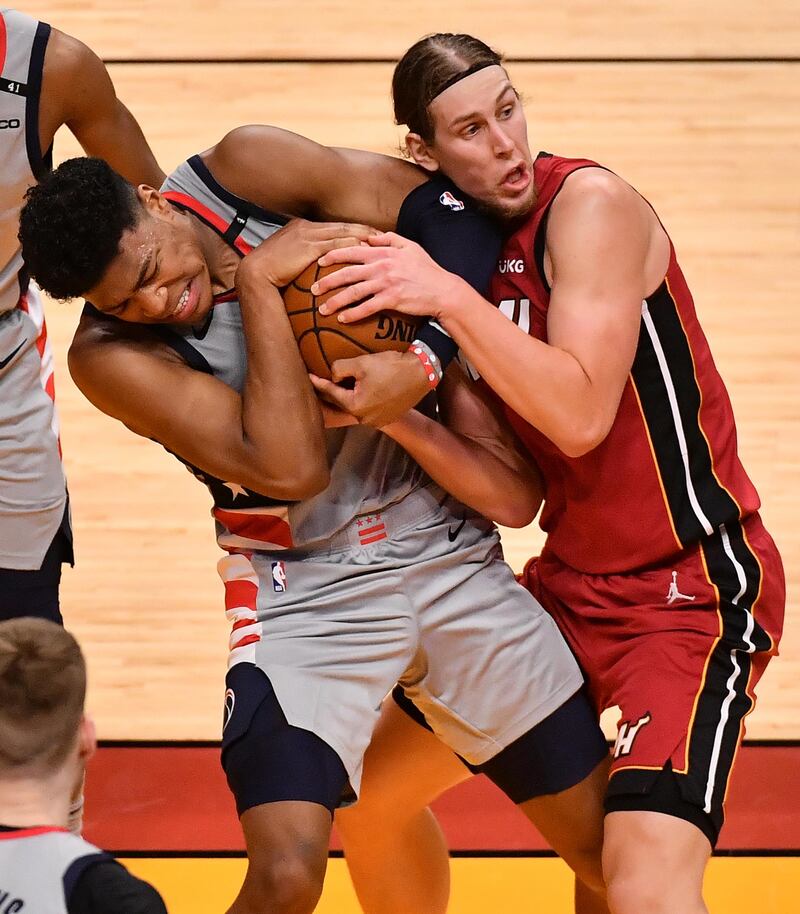 Washington Wizards forward Rui Hachimura, left, and Miami Heat forward Kelly Olynyk battle for possession during the NBA game at the American Airlines Arena in Florida, on Wednesday, January 3. USA TODAY Sports