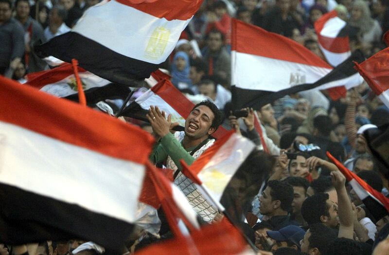 Demonstrators celebrate in Tahrir Square in Cairo during the early days of the Arab Spring in 2011. (Hussein Malla / AP)