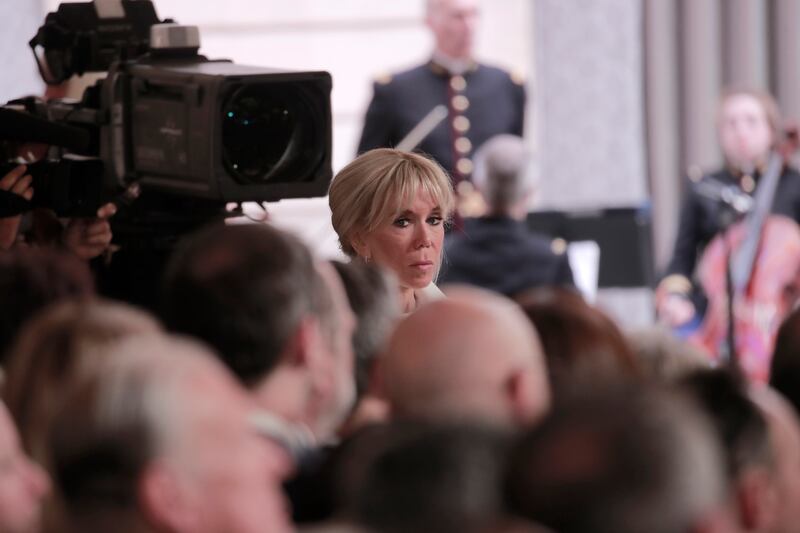 Brigitte Macron, wife of French President Emmanuel Macron, listens to her husband's speech. AP Photo