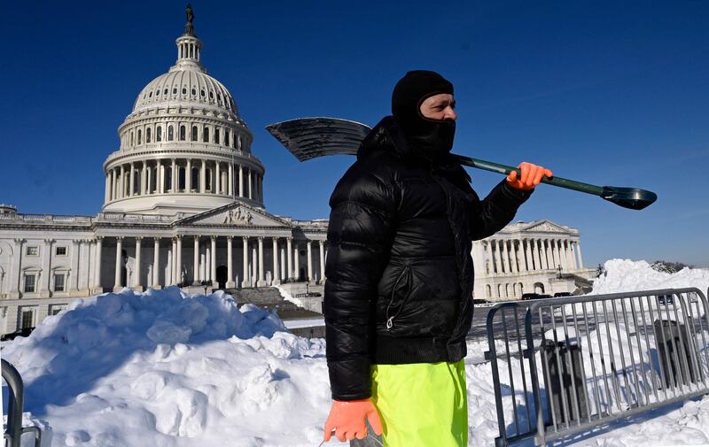 Workers remove snow from the eastern side of the US Capitol. AFP