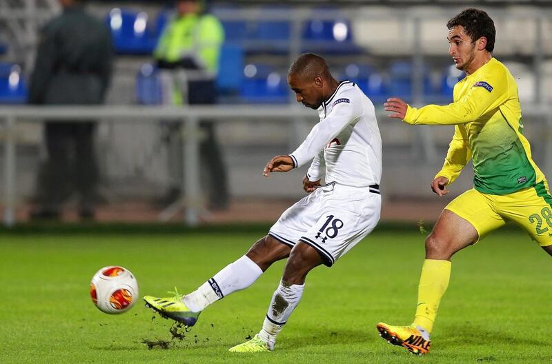 Tottenham's Jermain Defoe, left, scores the opening goal during a Europa League match at Anzhi Makhachkala in Moscow on Thursday. Maxim Shipenkov / EPA