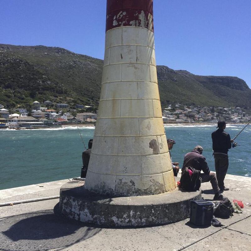 Fisherman cast their lines on a windy day in KalkBay near Cape Town. Antonie Robertson