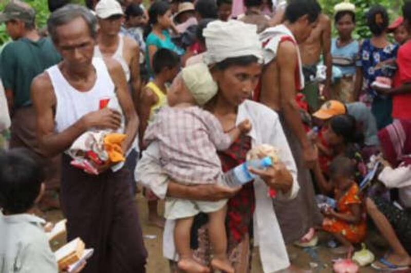 People receiving food aid in May in Dedaye, some 130km south-west of Yangon.