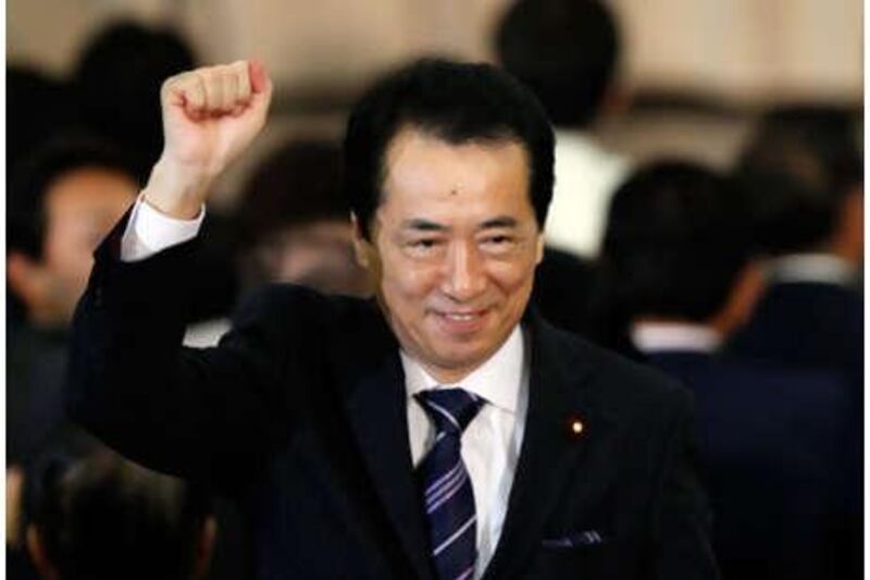 Japan's former finance minister Naoto Kan reacts after winning the Democratic Party of Japan party election in Tokyo on Friday, June 4, 2010.