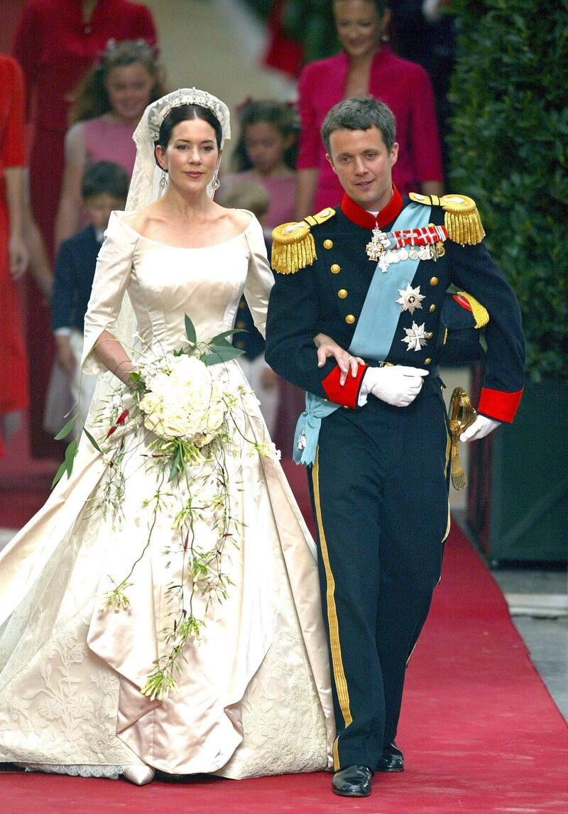 epa00191438 Danish crown prince Frederik (R) and his wife Mary Donaldson smile minutes after their weddingas they leave the cathedral in Copenhagen, Denmark, Friday, 14 May 2004. The church wedding of crown prince Frederik and Mary Donaldson from Australia took place today. Members of all European royal dynasties were among the 800 invited guests who attended the wedding. The thirtyfive-year-old heir to the Danish thrown met his thirtytwo-year-old bride during the Olympic Games in Sydney, Australia in 2000.  EPA/SRDJAN SUKI