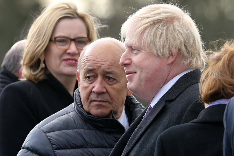 epa06450997 Britain's Foreign Secretary Boris Johnson (R) and French Foreign Minister Jean-Yves le Drian (C) attend a ceremony at the Royal Military Academy Sandhurst in Camberley, Britain, 18 January 2018. British Prime Minister Theresa May is expected to make an announcement as part of the Anglo-France Summit at The Royal Military Academy Sandhurst, where she will discuss migration Brexit and Britain's strong and wide-ranging bilateral relationship with President Macron.  EPA/LUDOVIC MARIN / POOL MAXPPP OUT