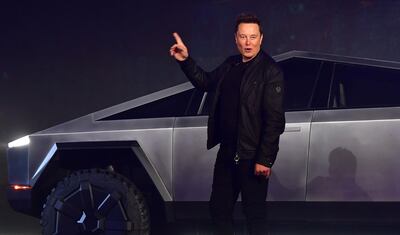 Tesla co-founder and CEO Elon Musk gestures while introducing the newly unveiled all-electric battery-powered Tesla Cybertruck at Tesla Design Center in Hawthorne, California on November 21, 2019.  / AFP / Frederic J. BROWN
