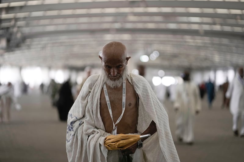An Iranian pilgrim on the way to the symbolic stoning of the devil, the last rite of the annual Hajj pilgrimage to Makkah, Saudi Arabia. AP