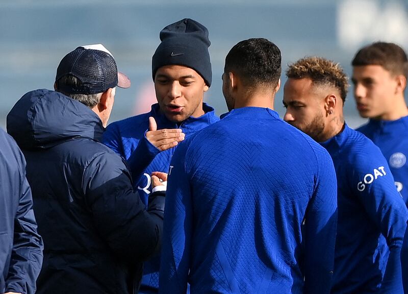 Kylian Mbappe speaks with PSG manager Christophe Galtier alongside Achraf Hakimi and Neymar. AFP