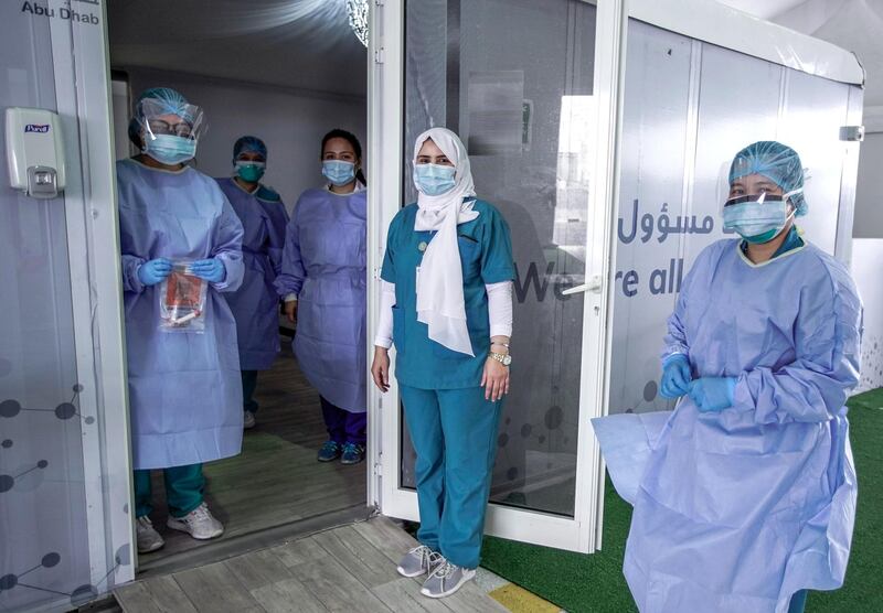 Dubai, United Arab Emirates, April 12, 2020.  The National Screening Center, Mina Rashed, Dubai.  Nurses smile for the camera while practicing social distancing.
Victor Besa / The National
Section:  NA
Reporter:  Nick Webster