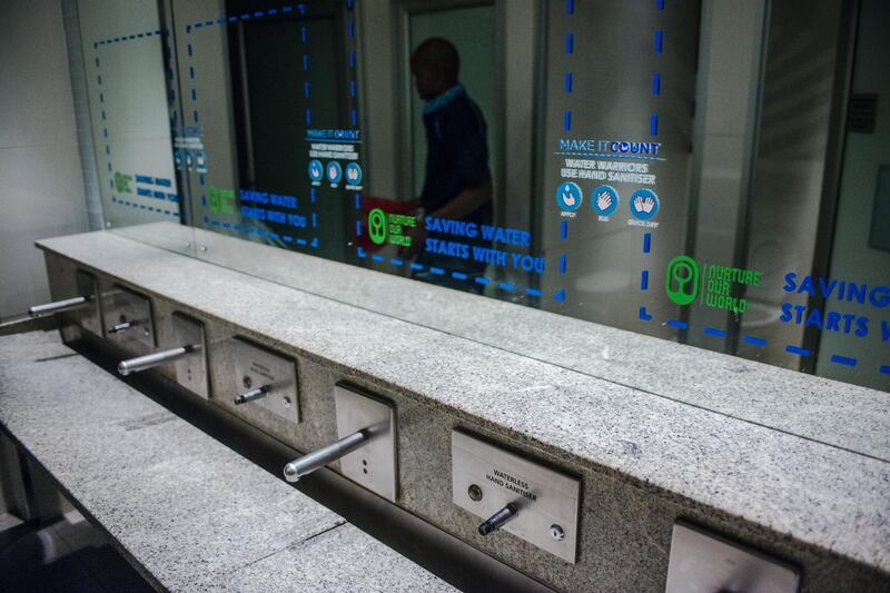 Signage indicating water conservation are displayed on the mirrors in the restrooms on the opening day of the Investing in African Mining Indaba in Cape Town, South Africa, on Monday, Feb. 5, 2018. Mining executives, investors and government ministers are meeting in drought-hit Cape Town for the African Mining Indaba, the continent’s biggest gathering of one of its most vital industries. Photographer: Waldo Swiegers/Bloomberg