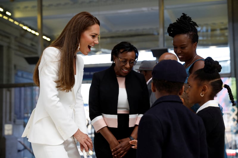 Kate speaks to children at the unveiling at Waterloo Station. AP Photo