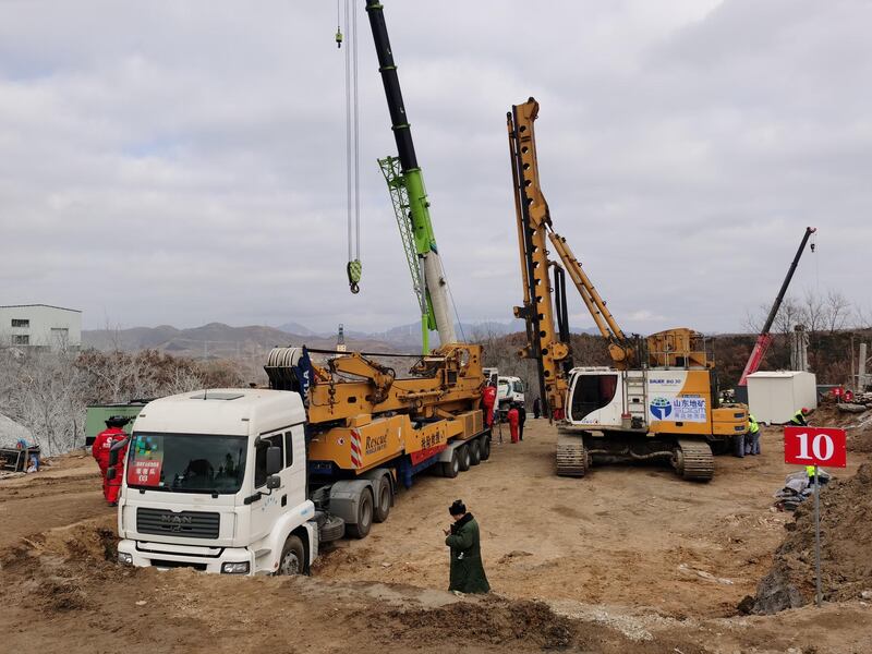 Rescuers are seen at the site where workers were trapped underground after an explosion at the gold mine under construction, in Qixia, Shandong province, China.  Reuters