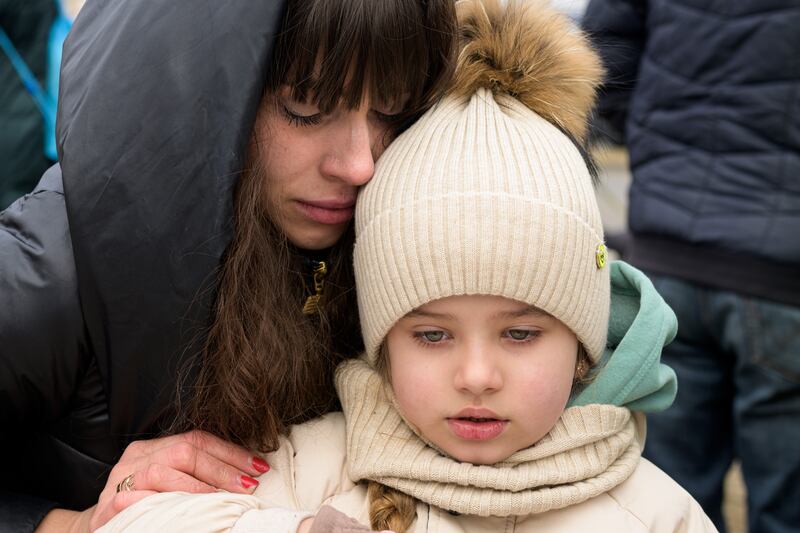 Angelika, 27, and her daughter Diana, 4, from Khmelnytskyi in Ukraine arrive at a reception centre on the outskirts of Przemysl, Poland. Photo: DEC
