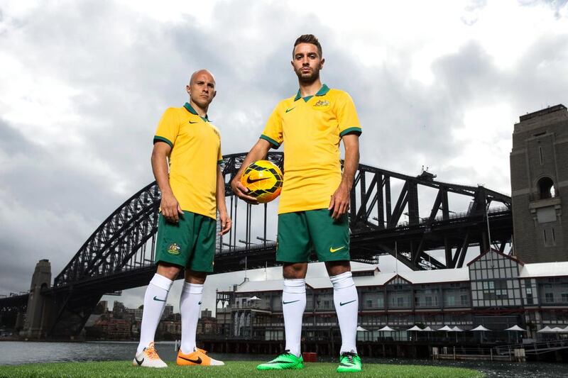 Mark Bresciano and Michael Zullo pose during the Australian Socceroos 2014 FIFA World Cup kit launch. Australia has sold 40,446 tickets so far, 2.7 per cent of the total. Matt King / Getty Images