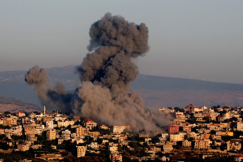 Black smoke billows following an Israeli air strike in the southern Lebanese village of Khiam near the Lebanese-Israeli border. AFP