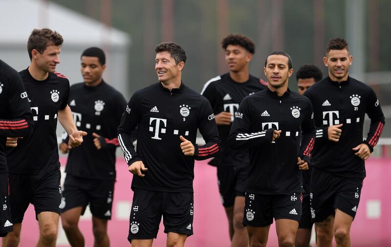 Soccer Football - Bayern Munich Training - Saebener Strasse, Munich, Germany - September 11, 2020  Bayern Munich's Thomas Muller, Robert Lewandowski and Thiago with teammates during training  REUTERS/Andreas Gebert