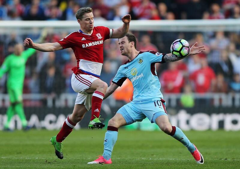 Adam Clayton of Middlesbrough, left, and Ashley Barnes of Burnley, right, battle for possession during the Premier League match between Middlesbrough and Burnley at Riverside Stadium on April 8, 2017 in Middlesbrough, England. Nigel Roddis / Getty Images