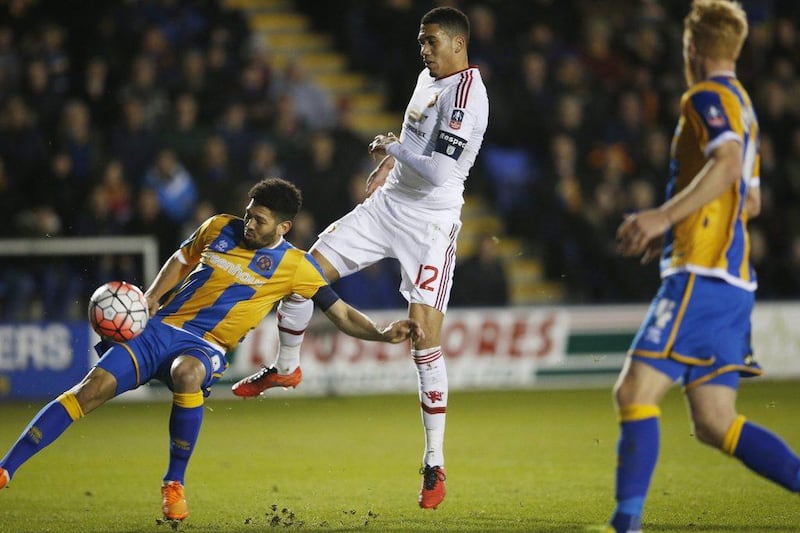Football Soccer - Shrewsbury Town v Manchester United - FA Cup Fifth Round - Greenhous Meadow - 22/2/16Manchester United's Chris Smalling scores their first goalAction Images via Reuters / Lee SmithLivepicEDITORIAL USE ONLY. No use with unauthorized audio, video, data, fixture lists, club/league logos or "live" services. Online in-match use limited to 45 images, no video emulation. No use in betting, games or single club/league/player publications.  Please contact your account representative for further details.