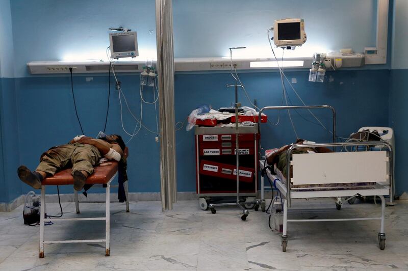 Injured soldiers of the eastern forces led by Khalifa Haftar, lie on beds at the Gharyan hospital, south of Tripoli, Libya June 27, 2019.  REUTERS/Ismail Zitouny
