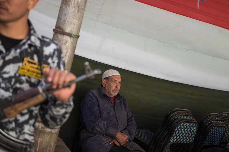 An Egyptian man waits outside a polling station before it is opens for day one of the presidential election in Cairo, Egypt. Mohamed Hossam / EPA