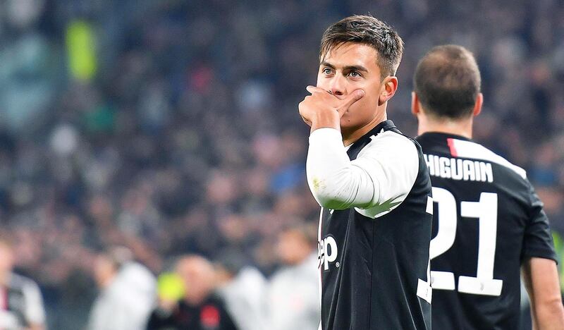 epa07987033 Juventus' Paulo Dybala (L) reacts next to teammate Gonzalo Higuain (R) after scoring the 1-0 lead during the Italian Serie A soccer match between Juventus FC and AC Milan in Turin, Italy, 10 November 2019.  EPA/ALESSANDRO DI MARCO