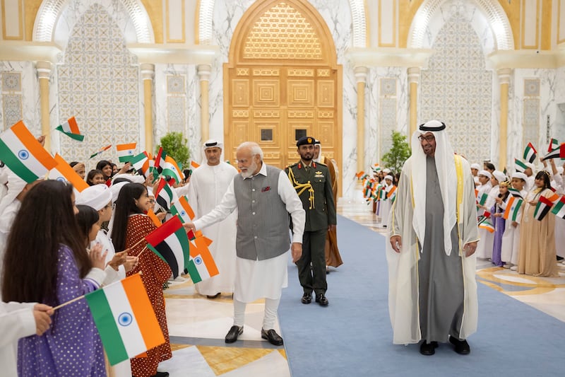 Narendra Modi, Prime Minister of India, is welcomed by school children during an official reception hosted by President Sheikh Mohamed at Qasr Al Watan. Ryan Carter / UAE Presidential Court 