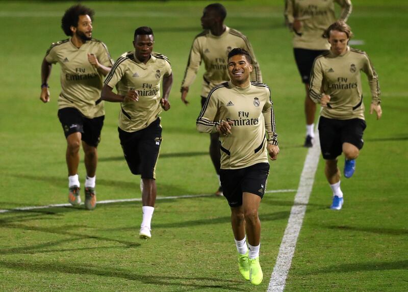 Real Madrid midfielder Casemiro leads his teammates in a run during training in Jeddah. Getty Images