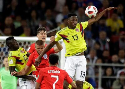 Colombia's Yerry Mina (13) jumps for the ball during the round of 16 match between Colombia and England at the 2018 soccer World Cup in the Spartak Stadium, in Moscow, Russia, Tuesday, July 3, 2018. (AP Photo/Matthias Schrader)