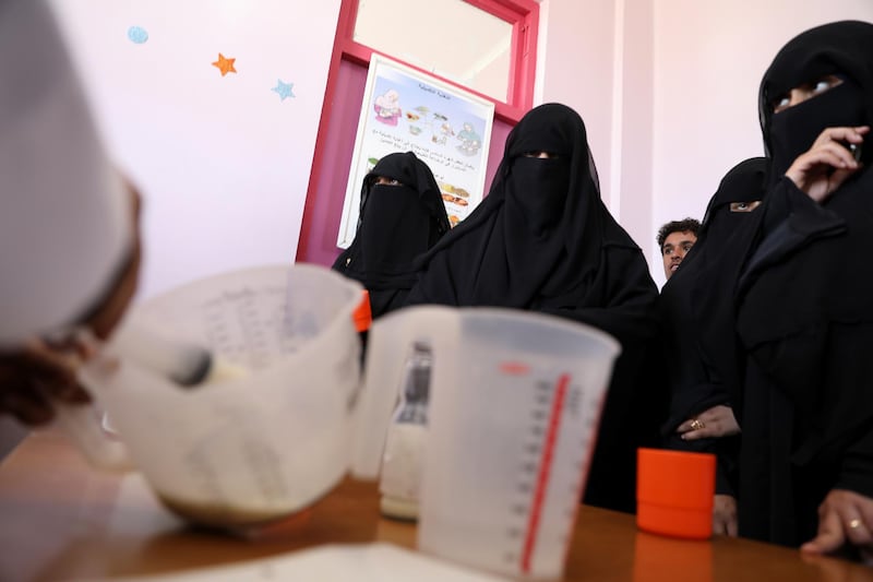 Women wait to receive supplemental nutrition shakes at malnutrition treatment ward of al-Sabeen hospital in Sanaa, Yemen. Reuters