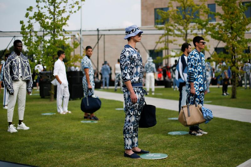 Models, maintaining social distance, present creations from the Dolce & Gabbana Spring / Summer 2021 men's collection in a live-streamed show during Milan Digital Fashion Week. Reuters