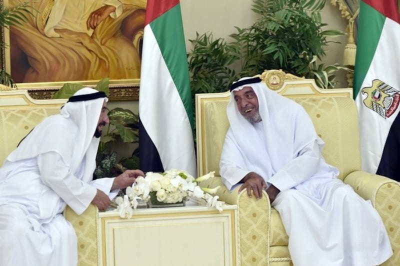 President Sheikh Khalifa bin Zayed, right, exchanges Eid Al Fitr greetings with Dr Sheikh Sultan bin Mohammed Al Qasimi, Ruler of Sharjah, at Al Bateen Palace. WAM