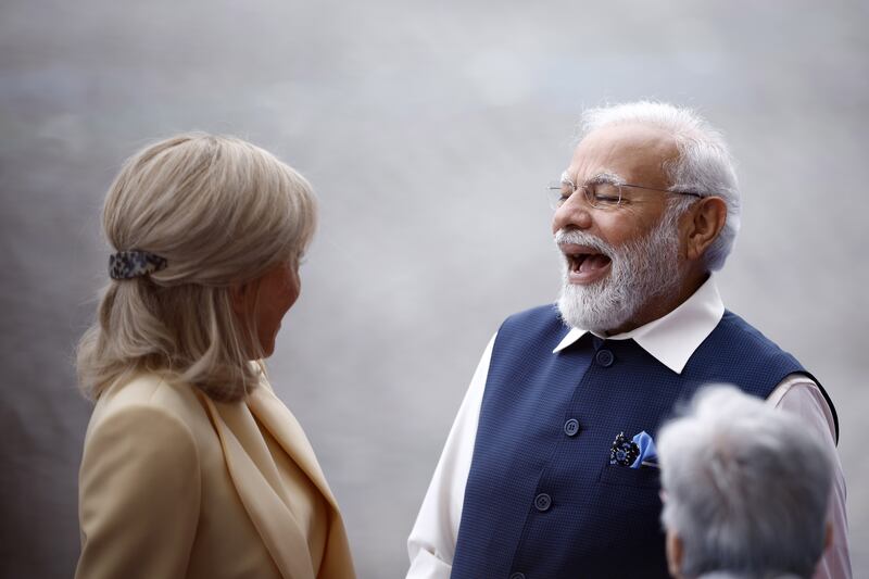Ms Macron and Mr Modi in the French capital, where the Indian PM was on a two-day visit. EPA