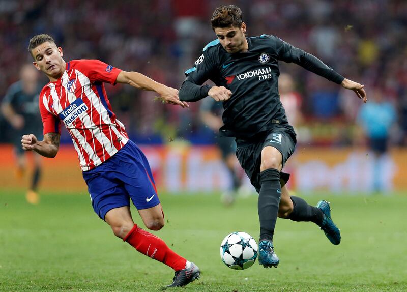 Atletico Madrid's Lucas and Chelsea's Alvaro Morata challenge for the ball. Francisco Seco / AP Photo