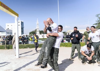 DUBAI, UNITED ARAB EMIRATES. 13 FEBRUARY 2020. 
Orsis Andrade Silva, 50, left, officer at the Brazilian internal security, celebrates his team’s win.

Brazil’s team at the start line of the obstacles challenge at the second annual UAE Swat Challenge. The team made it to the finishing line. Twenty-six teams from around the world are taking part in the five-day event.


(Photo: Reem Mohammed/The National)

Reporter:
Section: