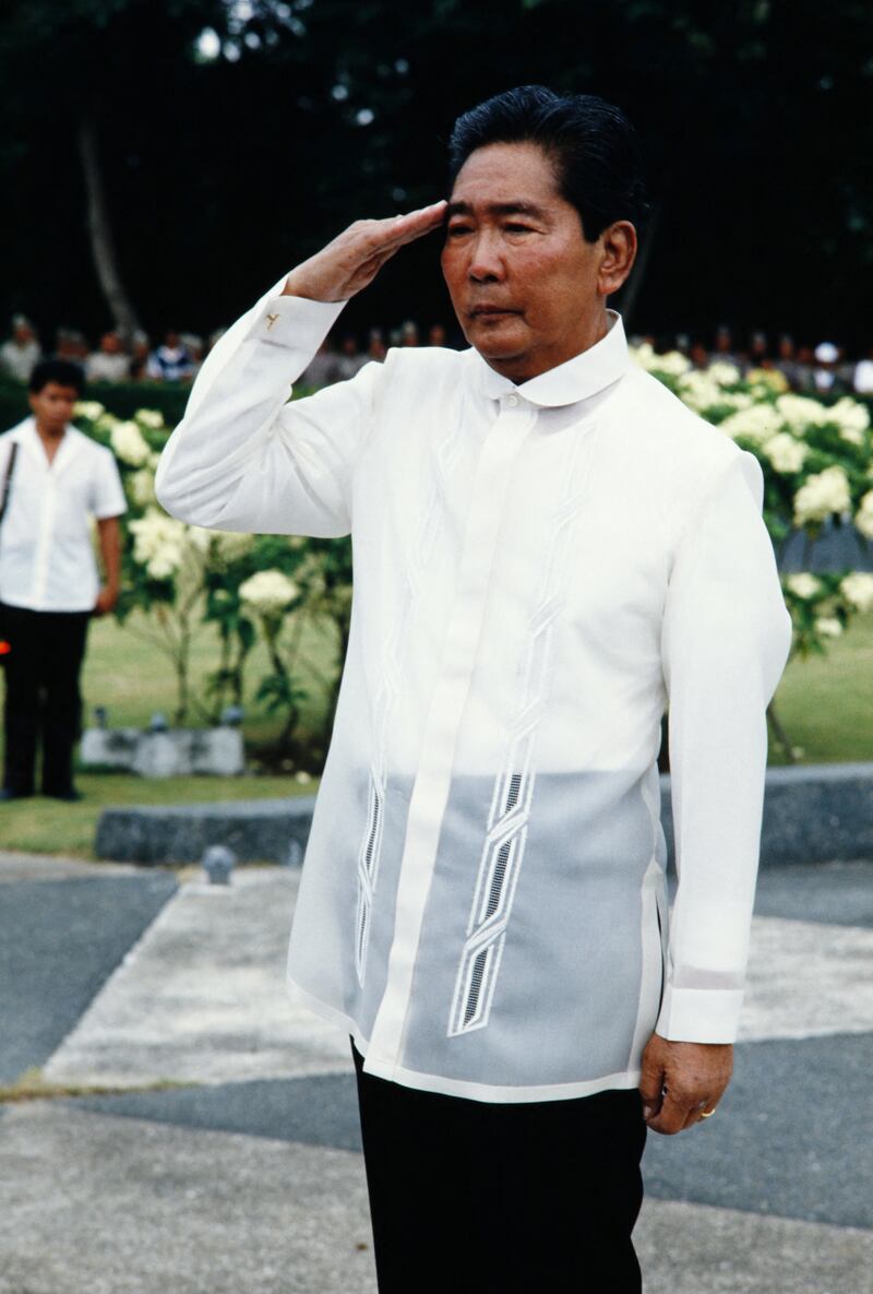 Marcos salutes during the 84th anniversary of the foundation of the Philippine Constabulary in Manila on August 25, 1985. AFP 